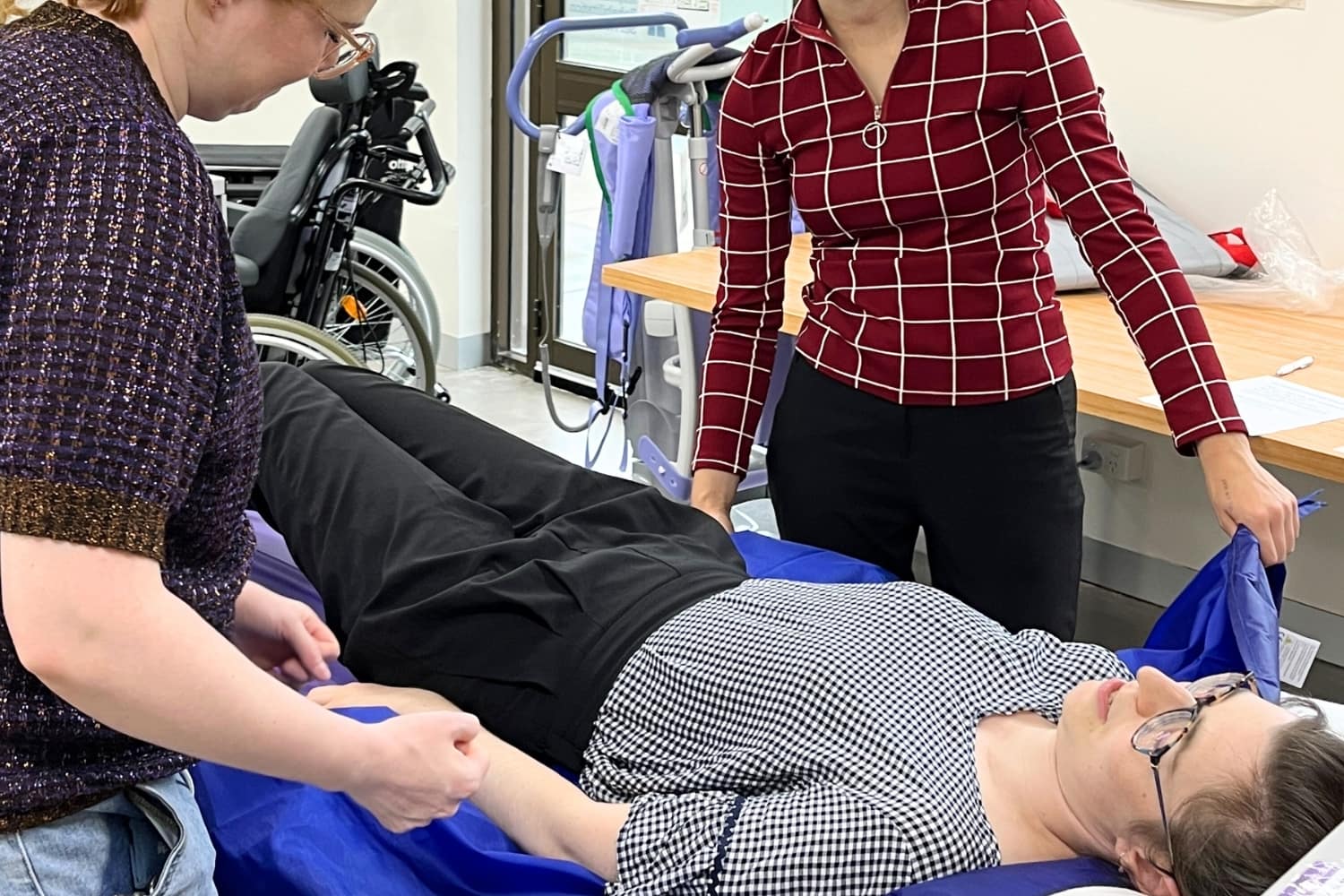 Physiotherapists in a hands on tute